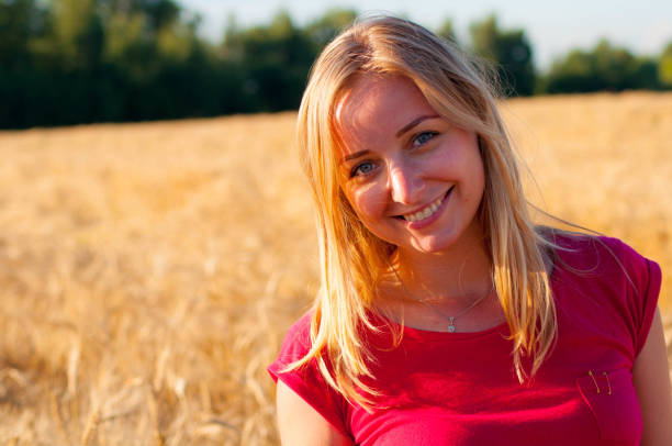 istock Girl in the field rye 896772284