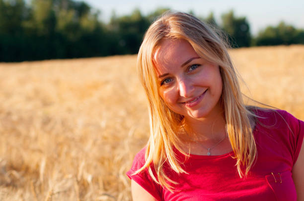 istock Girl in the field rye 896772554