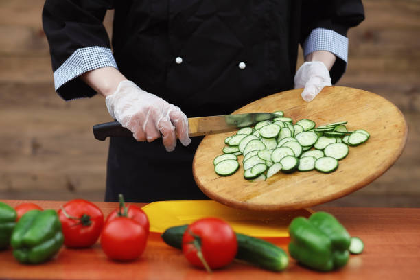 istock The cook cuts fresh farm vegetables 896777036