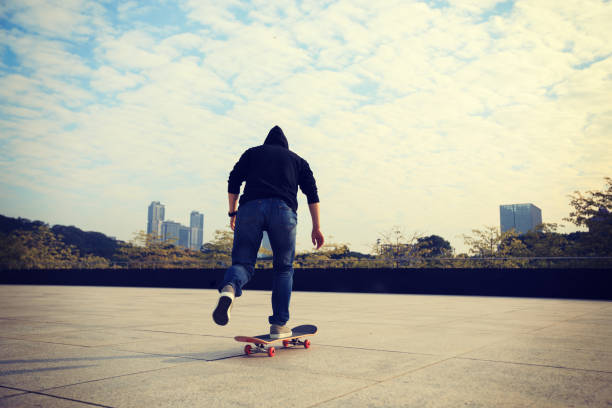 istock female skateboarder riding with skateboard on city 896777124