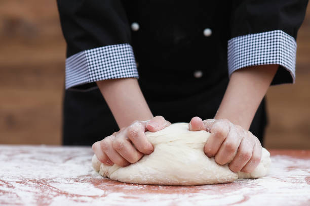 istock the cook makes flour for baking on the table 896777432
