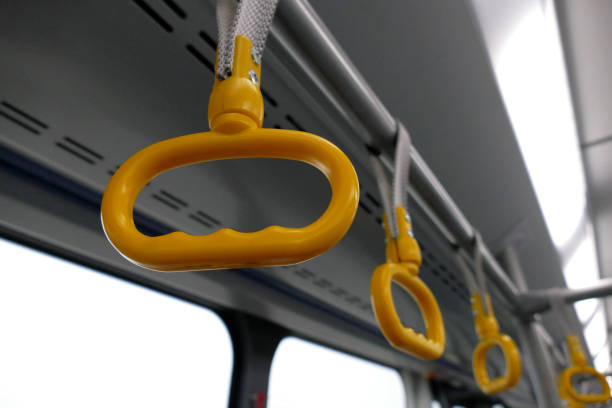 istock Hand holders in bus without people in it 896790548