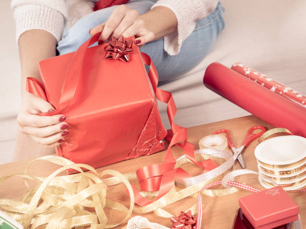 istock Woman packing christmas gifts 896790944