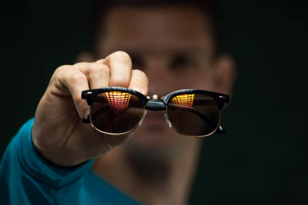 istock Closeup man holding stylish eyeglasses in hands 896802822