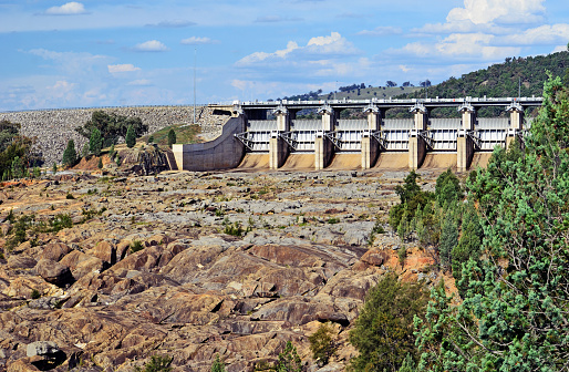 Radial Spillway gates of Wyangala Dam at the junction of the Lachlan and Abercrombie Rivers, central west region, New South Wales, Australia. Built for flood mitigation, hydroelectricity and to supply water for irrigation of agriculture in the Lachlan Valley.