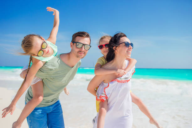 istock Happy family on beach vacation 896814028