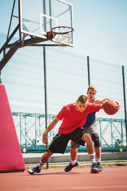 istock Skilled basketball professionals practicing on the court one on one 896815452