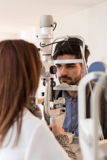 istock Young man having his eyes examined 896819618