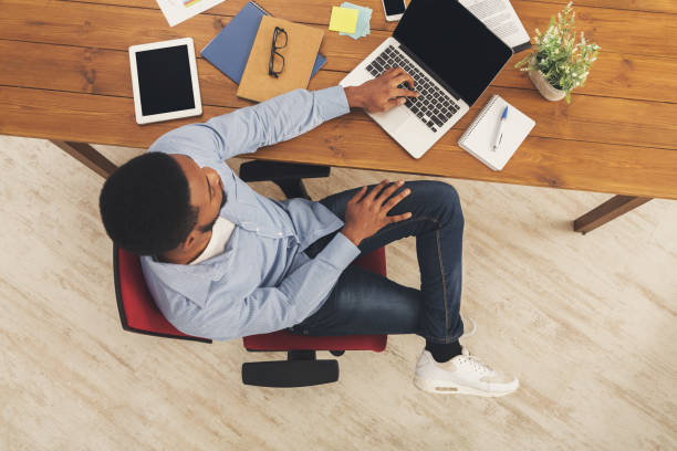 istock African-american businessman typing on laptop 896820022