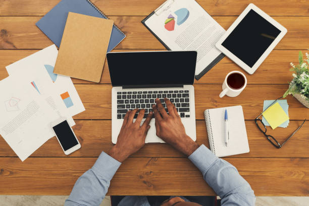 istock African-american businessman typing on laptop 896820078
