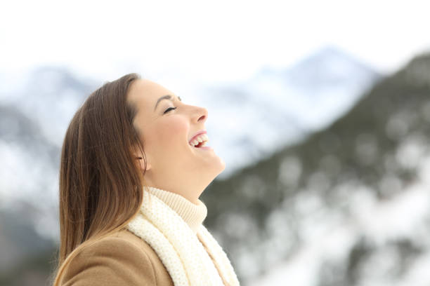 istock Female breathing in the mountain in winter 896822426