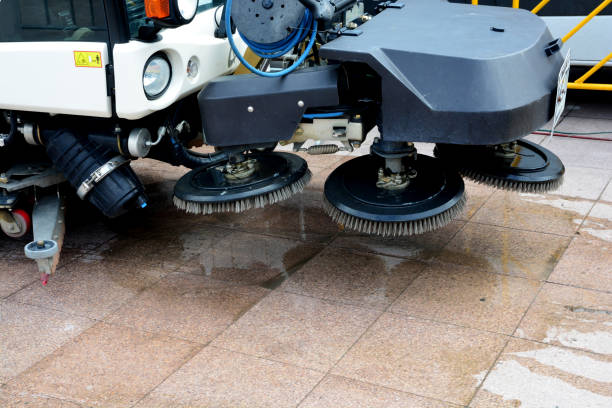 istock urban sweeper cleans road from dirt with a round brush 896823370