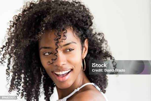 Portrait Of A Beautiful Young Black Woman Looking Into Camera N Stock Photo - Download Image Now