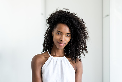 Portrait of a beautiful young black woman looking into camera 