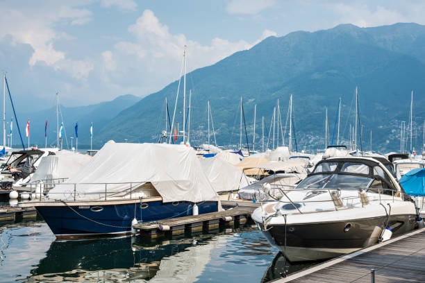 Locarno, Switzerland - May 28, 2016: Speed boats and yachts on the pier of the alpine Maggiore Lake in Locarno, Switzerland.