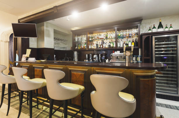istock Hotel lounge bar with bottle shelfs and seats 896828346