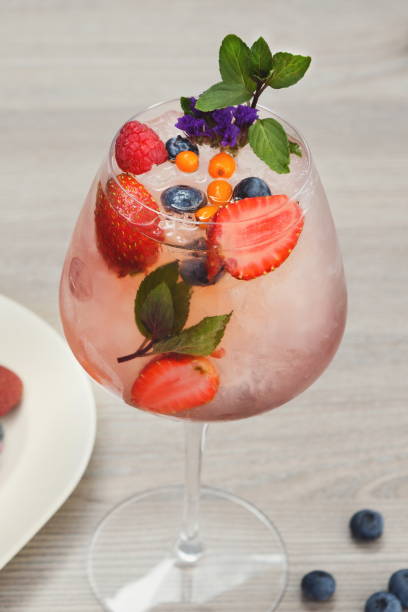 istock Cocktail with champagne against blue background 896831704