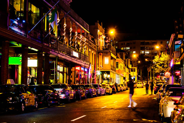 istock Colorful lit downtown street at night 896837142