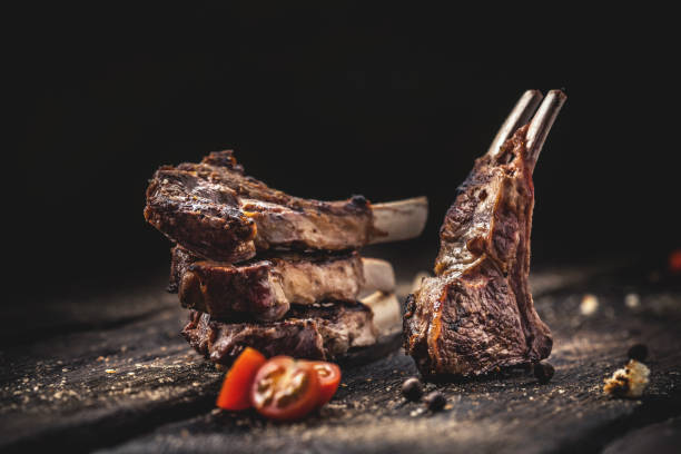 istock Grilled lamb chops on wooden table 896842066