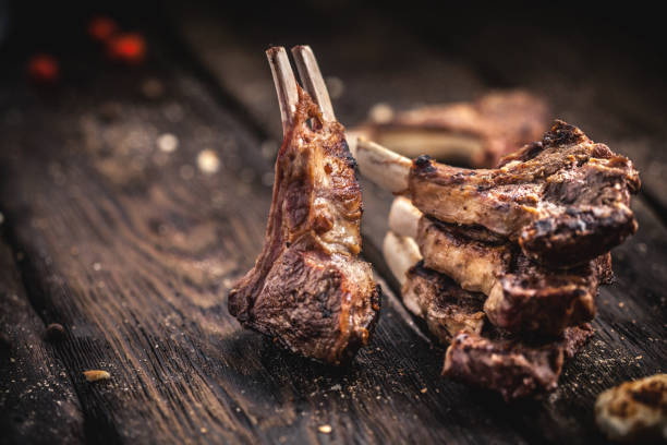 istock Grilled lamb chops on wooden table 896842270