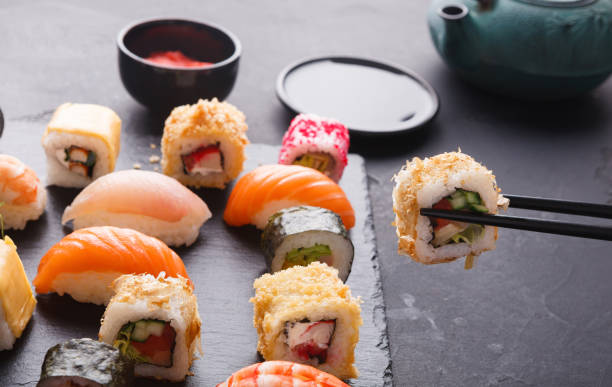 istock Eating sushi at restaurant, japanese cuisine 896845732