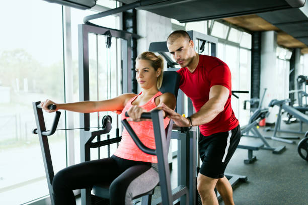 istock Beautiful girl working out with personal trainer 896845978