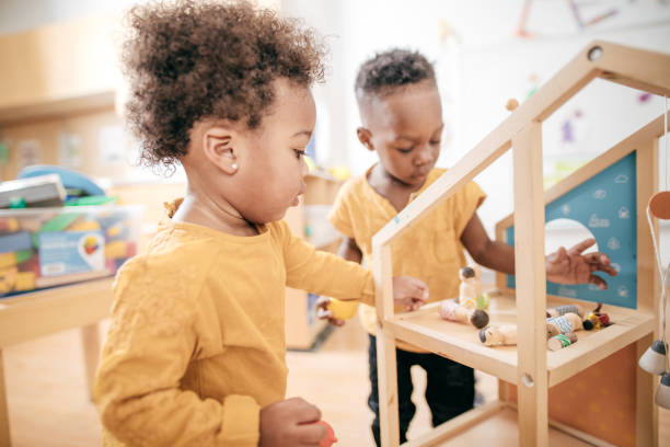 istock Friends playing together in daycare 896848456