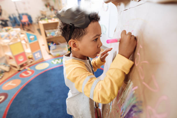 istock 4years old boy drawing  new pic in daycare 896848508