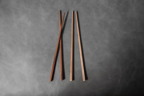 istock Collection of wooden chopsticks on background 896858072