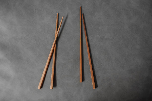 istock Collection of wooden chopsticks on background 896858088