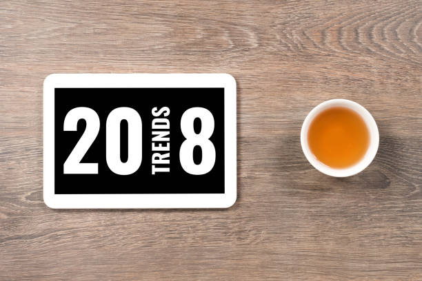 istock 2018 trends, text in digital tablet or smart phone on white office table 896858480
