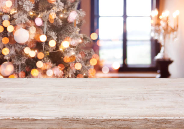 istock Christmas background with light spots, bokeh window and wooden tabletop 896870332