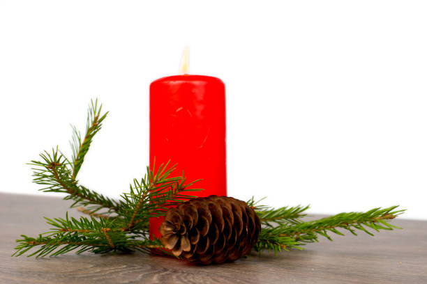 istock christmas composition with red candle and fir tree branch 896880918