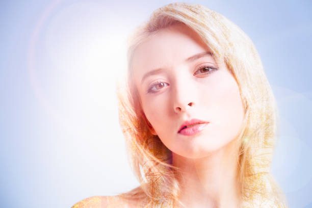 Facial expressions. Face of a pleasant young attractive woman while looking at you