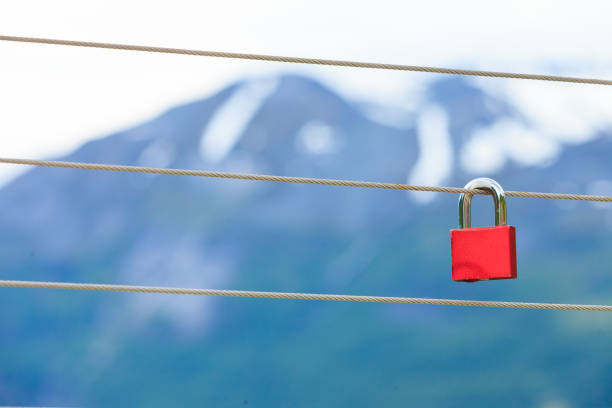 istock Red padlock and Geirangerfjord from Flydasjuvet viewpoint Norway 896892376