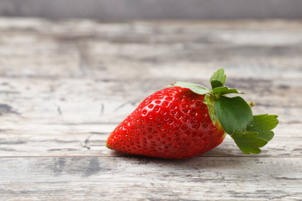 istock Fresh strawberries on a wooden table 896906786