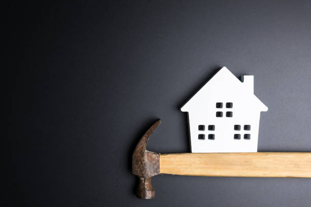 istock White house toy and construction tools on black background with copy space.Real estate concept, New house concept, Finance loan business concept, Repair maintenance concept. 896909426