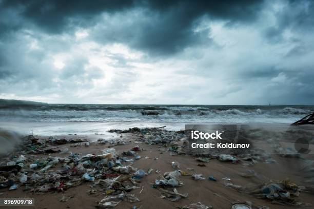 Garbage On Beach Environmental Pollution In Bali Indonesia Storm Is Coming And Drops Of Water Are On Camera Lens Stock Photo - Download Image Now