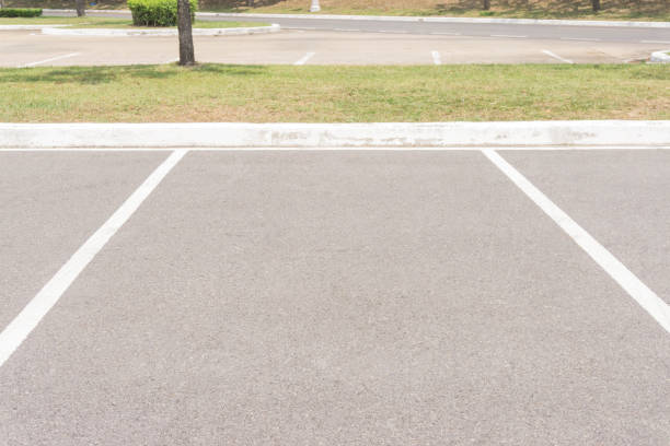 istock Empty Space in a Parking Lot / Empty space parking lot outdoor in public park. 896910204