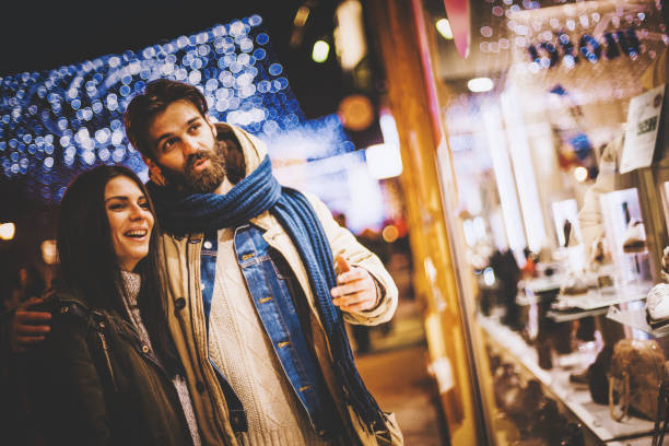 istock Attractive hipster couple in front of retail window 896912310