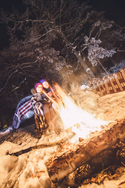 istock Couple enjoying next to the camp fire 896912414