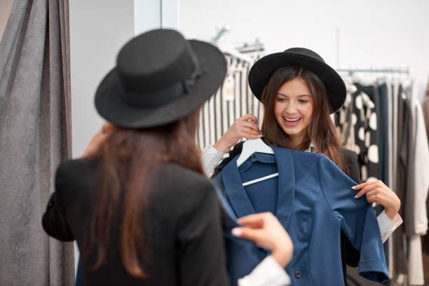 istock Young woman shopping for clothes 896913156