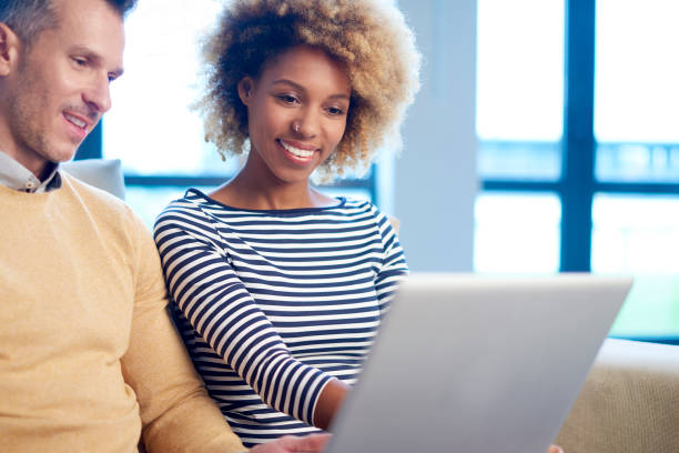 istock Two people surfing on the internet 896916660