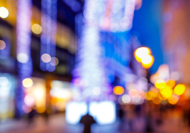 istock Blurry night lights, walking people at christmas 896919908