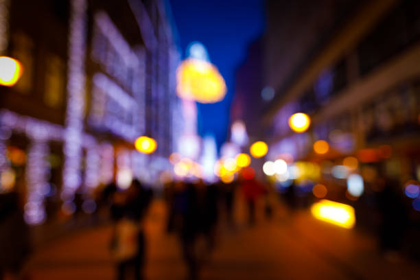 istock Blurry night lights, walking people at christmas 896919926