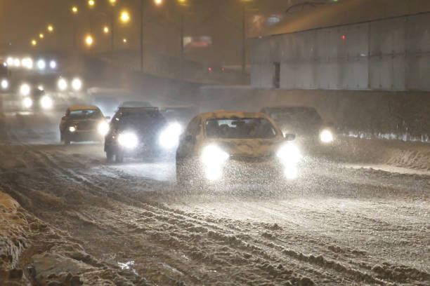 istock snowfall on the evening streets. blur specifically enhance movement 896920236