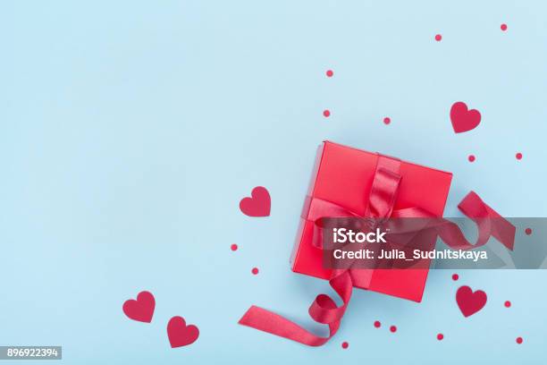 Present Or Gift Box Paper Heart And Confetti On Blue Background Top View Valentines Day Greeting Card Stock Photo - Download Image Now