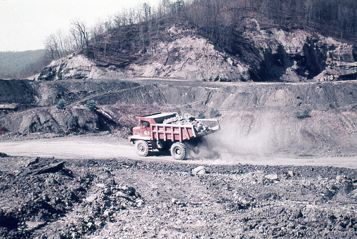 Dump truck carrying rock in coal strip mine near Frakes, Kentucky in 1975. Scanned film.