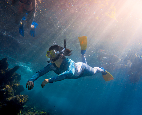 Underwater Image Of Woman Free Diving Into The Sea Stock Photo Underwater Image Of Woman Free Diving Into The Sea Stock Photo