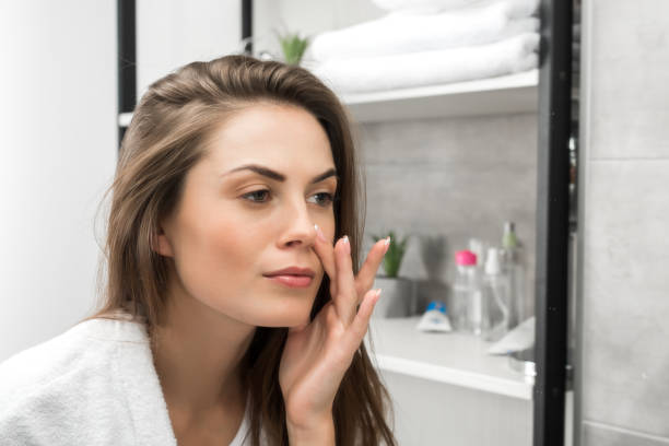 istock Girl checking face skin 896930330